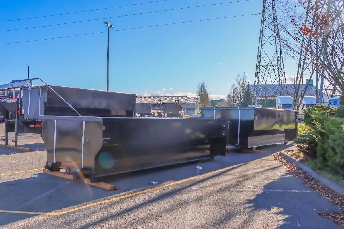Roll-off dumpster ready for waste disposal at job site for 3 Yard Dumpster Rental in Georges